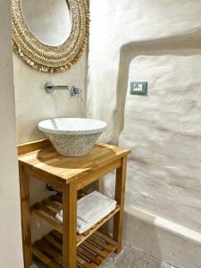 a bathroom with a sink and a mirror at Ruggine Loft in Gallipoli