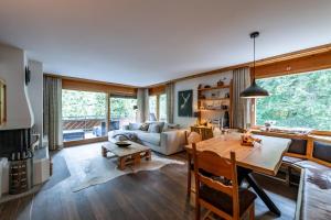 a living room with a table and a couch at Chalet Belmont in Flims