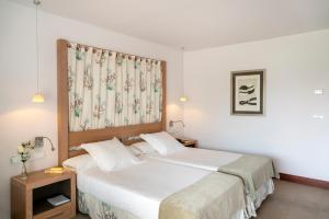 Postel nebo postele na pokoji v ubytování Parador de Mojácar