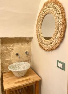 a bathroom with a sink and a mirror at Ruggine Loft in Gallipoli +31 photos