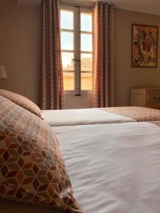 Postel nebo postele na pokoji v ubytování Hôtel du Musée