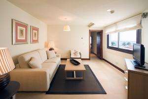 a living room with a couch and a table at Parador de Moj&aacute;car in Moj&aacute;car