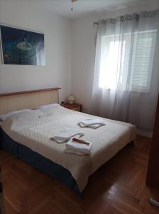 Posteľ alebo postele v izbe v ubytovaní Apartment Agava, 200m from Kamenjak, own terrace, garden and parking, new kitchen