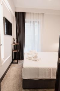 Un pat sau paturi într-o cameră la Persona Hotel Galata