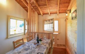a dining room with a table in a wooden house at CHALET SIMONETTA - Locanda da Tullio in Capovalle