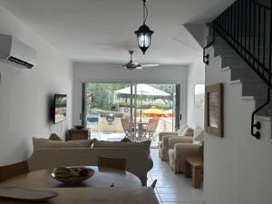 a living room with a couch and a table at Immaculate 2-Bed House in Polis Cyprus Air-Con in Polis Chrysochous