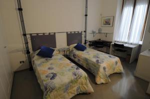 Cama o camas de una habitación en Le Corti Di Aloa Milano