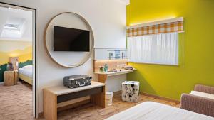 TV/Unterhaltungsangebot in der Unterkunft Hey Lou Hotel Piding