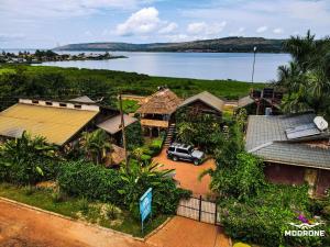 an aerial view of a village with a car parked in a driveway at HomeOnTheNile in Jinja