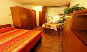 A bed or beds in a room at Residence Valfurva