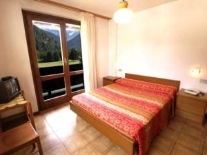 A bed or beds in a room at Residence Valfurva