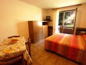 A bed or beds in a room at Residence Valfurva