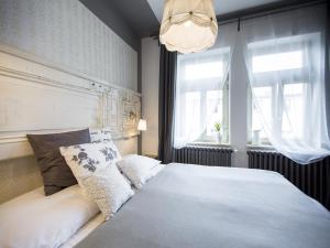 a bedroom with a bed and a window at Miss Sophie's New Town & Wellness in Prague