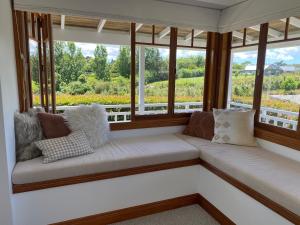 a window seat in a room with a view at Riverview Retreat in Riverhead