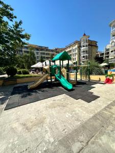 a playground with a slide in a park at Summer Dreams B26 in Sunny Beach