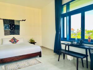 Postel nebo postele na pokoji v ubytování Chez Mimosa Hoi An - LUA Retreat