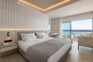 A bed or beds in a room at Mediterranean Hotel