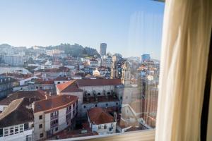 a view of a city from a window at Hotel Bahía de Vigo in Vigo