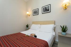 Postel nebo postele na pokoji v ubytování Hotel L'Aretino