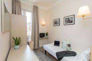 Postel nebo postele na pokoji v ubytování Hotel L'Aretino