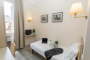 Postel nebo postele na pokoji v ubytování Hotel L'Aretino