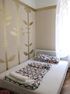 a bedroom with two beds with pillows on it at Centar Guesthouse in Zagreb