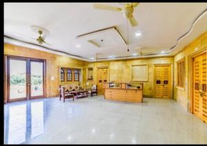 a large living room with a ceiling fan at Jasmeet hotels in Jaisalmer