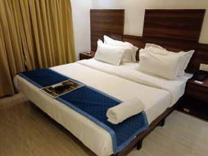 Postel nebo postele na pokoji v ubytování HOTEL GOLDEN TULIPZ