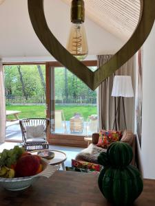 a living room with a bowl of fruit on a table at Familiehuis Lytse Miede in Formerum