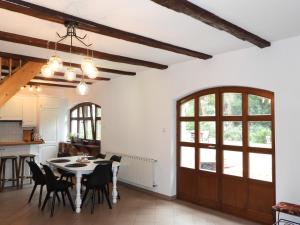 a kitchen and dining room with a table and chairs at 5 Stars in Jabłonka Stara