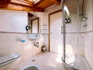 a bathroom with a shower and a sink and a toilet at Residenza Ester in Amalfi