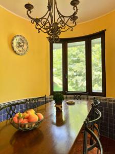 a kitchen with a table with a bowl of fruit on it at Sulle piste di Limone Piemonte in Limone Piemonte