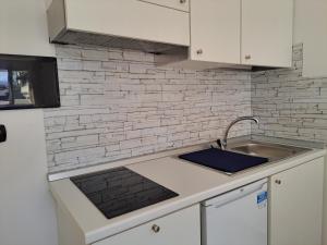 Kuchyň nebo kuchyňský kout v ubytování Maresol Residence