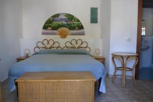 Postel nebo postele na pokoji v ubytování Hotel Scoglio Bianco