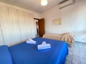 Postel nebo postele na pokoji v ubytování Imperiale Apartment