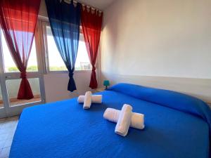 Postel nebo postele na pokoji v ubytování Imperiale Apartment