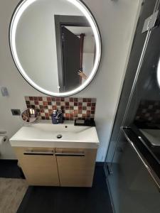 a bathroom with a sink and a mirror at L’Egyptienne in Antibes +7 photos