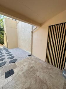a room with a gate and a concrete floor at L’Egyptienne in Antibes