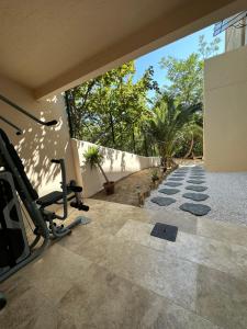 an empty room with a gym with a wall at L’Egyptienne in Antibes