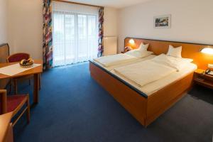 Giường trong phòng chung tại Trip Inn Aktivhotel Sonnenhof bei Passau