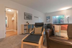 a living room with a leather couch and a chair at Galena Getaway Dog Friendly Frisco Retreat in Frisco