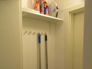 a locker room with a refrigerator in a room at Ferienwohnung am Sulzbach in Sulzburg