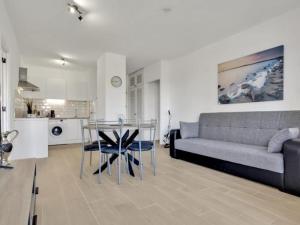 a living room with a couch and a glass table at 212 Elegant, renovated, confortable Playa Paraiso in Playa Paraiso