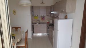 Cucina o angolo cottura di Bellissimo attico a 70 mt dalla spiaggia