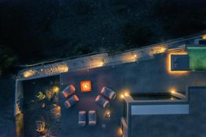 an aerial view of a building at night with lights at Inspiration House in Souda