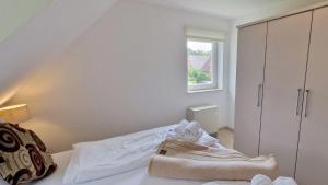 Voodi või voodid majutusasutuse Haus-zum-Leuchtturm-Whg-03 toas