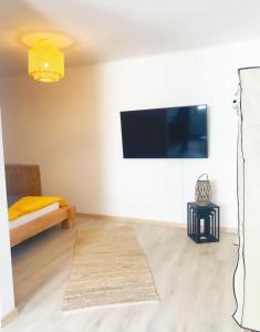 TV a/nebo společenská místnost v ubytování Beach Appartement