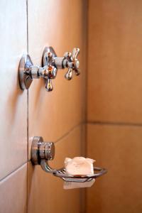 a piece of cake on a plate in a shower at iroCK Lodge in Victoria Falls