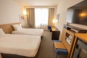 Letto o letti in una camera di Novotel Salerno Est Arechi