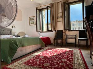 Postel nebo postele na pokoji v ubytování Venice Guest House